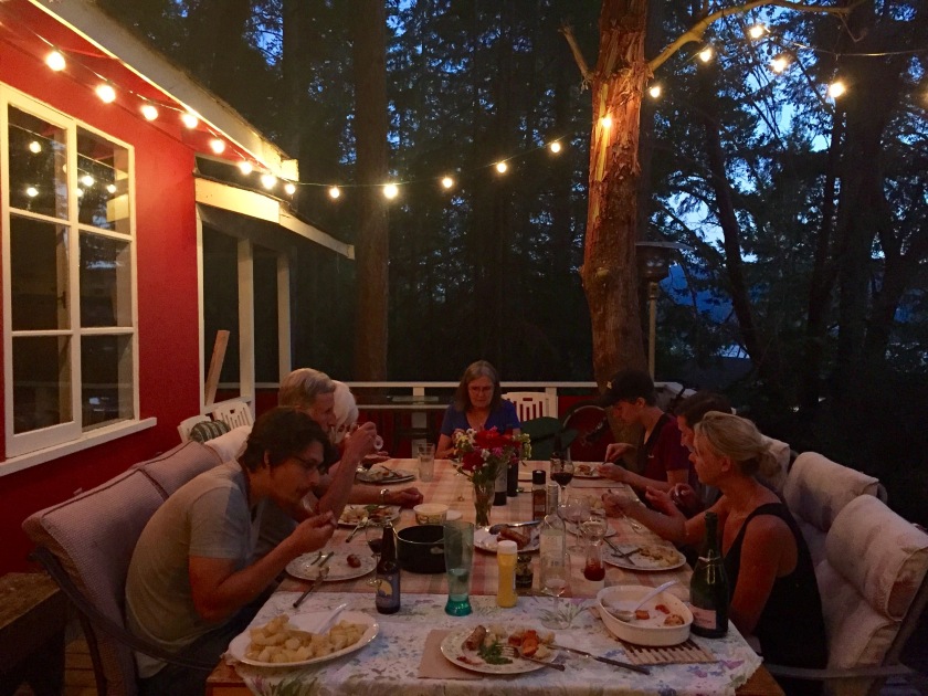 Amanda's family having dinner outside.