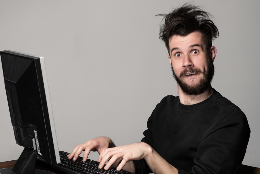 Funny and crazy man using a computer By master1305